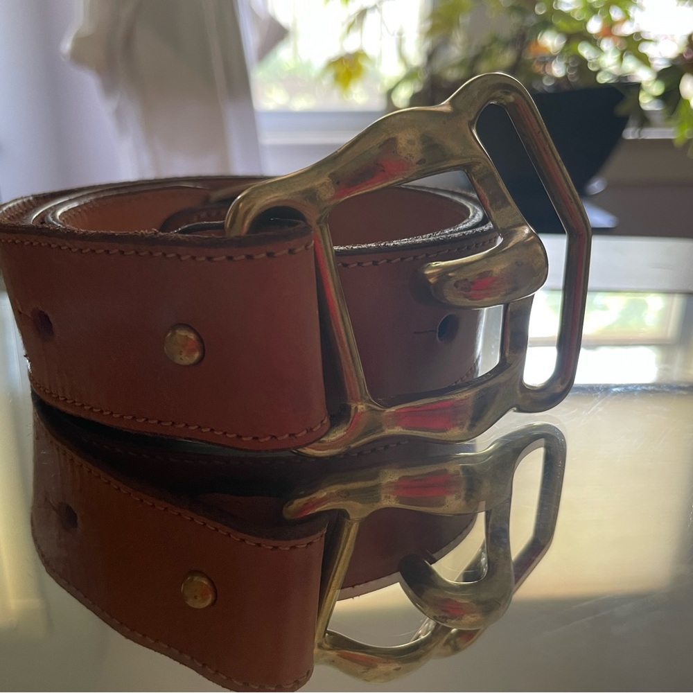 Vintage DKNY tan leather belt with brass clasp buckle.
